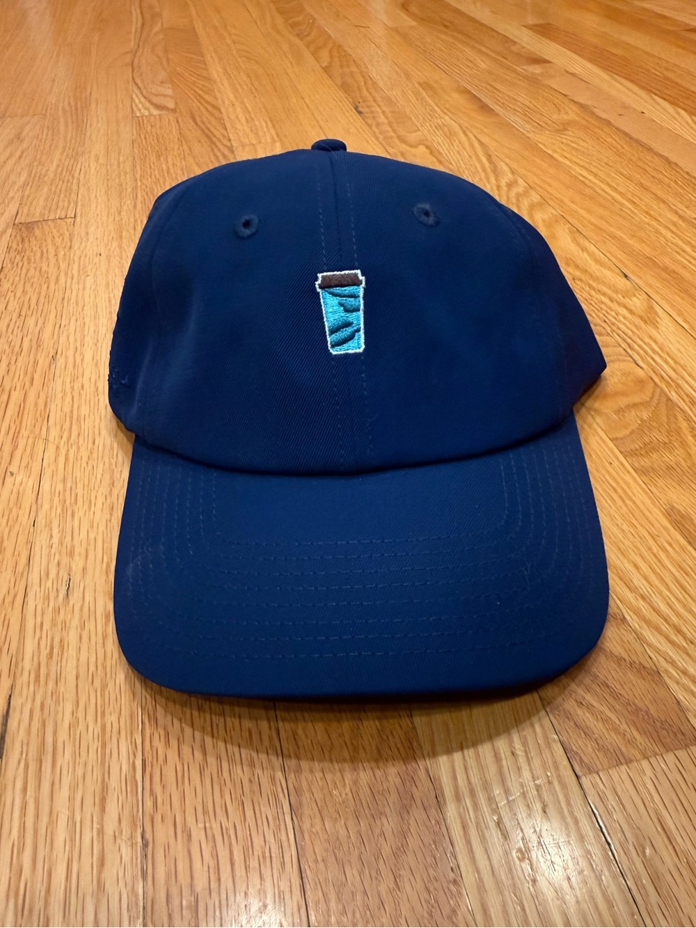 Caribou Coffee Navy Blue Casual Cap with Embroidered Cup Accent
